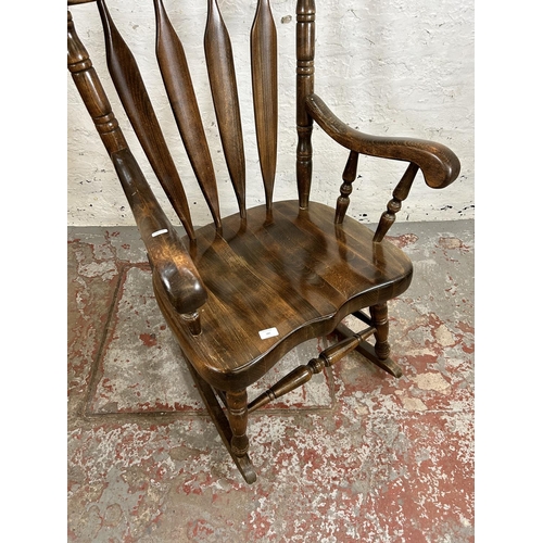 185 - A Victorian style beech farmhouse rocking chair