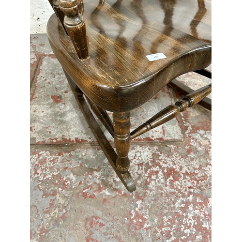 185 - A Victorian style beech farmhouse rocking chair