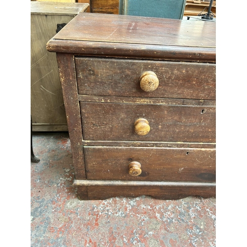 186 - A Victorian stained pine chest of three drawers