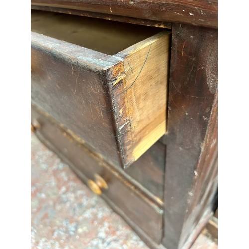 186 - A Victorian stained pine chest of three drawers