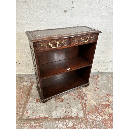 189 - An Indian brass inlaid and carved hardwood two tier open bookcase with two drawers