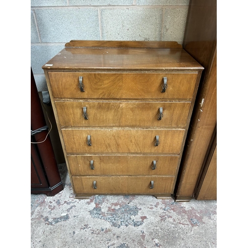 19 - An Art Deco style walnut three piece bedroom suite comprising dressing table, double wardrobe and ch... 