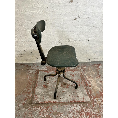 195 - A 1950s Leabank green vinyl and black metal swivel machinist’s chair