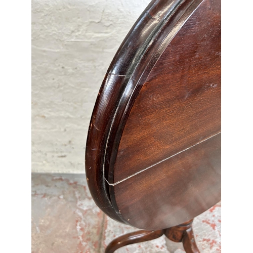 198 - A George III mahogany oval tilt top occasional table on tripod pedestal support