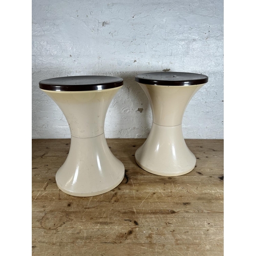 2 - A pair of 1970s brown and cream plastic circular side tables - approx. 45cm high x 33cm diameter