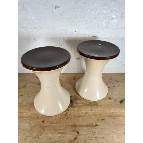 2 - A pair of 1970s brown and cream plastic circular side tables - approx. 45cm high x 33cm diameter