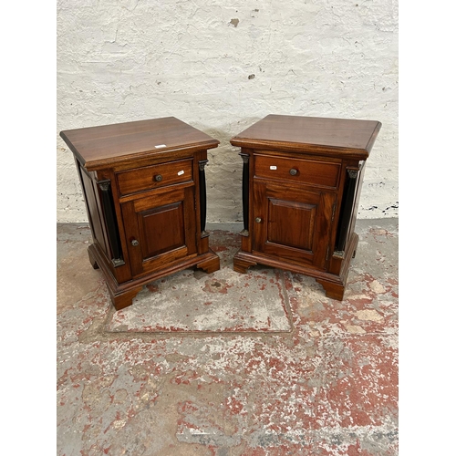201 - A pair of French Empire style mahogany bedside cabinets