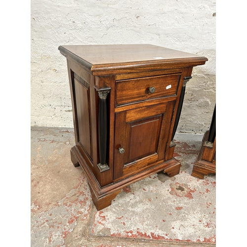 201 - A pair of French Empire style mahogany bedside cabinets