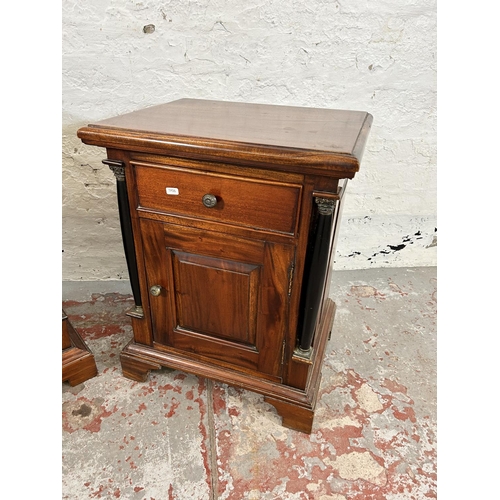 201 - A pair of French Empire style mahogany bedside cabinets