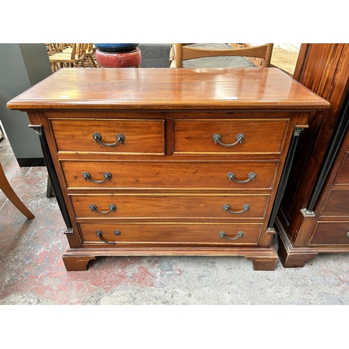 202 - A French Empire style mahogany chest of two short over three long drawers