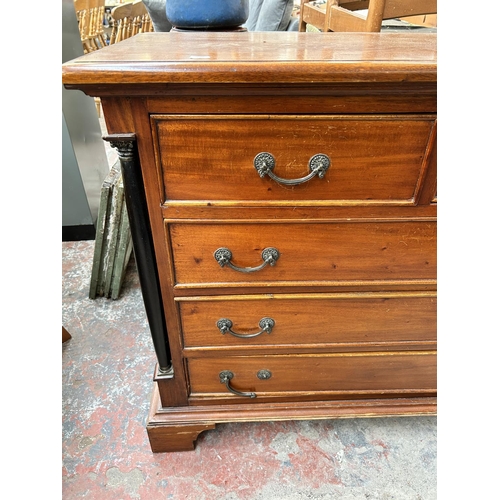 202 - A French Empire style mahogany chest of two short over three long drawers
