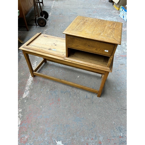 205 - An oak telephone seat