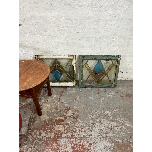 210 - Six pieces of furniture, two 1930s stained glass windows, two vinyl upholstered circular footstools ... 