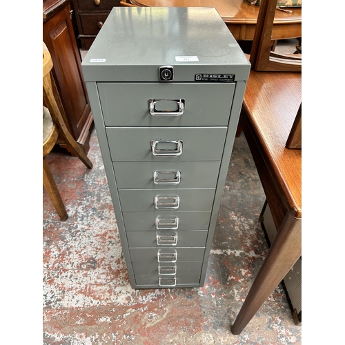 211 - A Bisley grey metal nine drawer office filing cabinet - approx. 94cm high x 28cm wide x 41cm deep