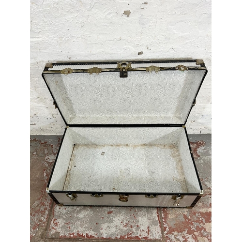 215 - A mid 20th century silver and black painted travel trunk