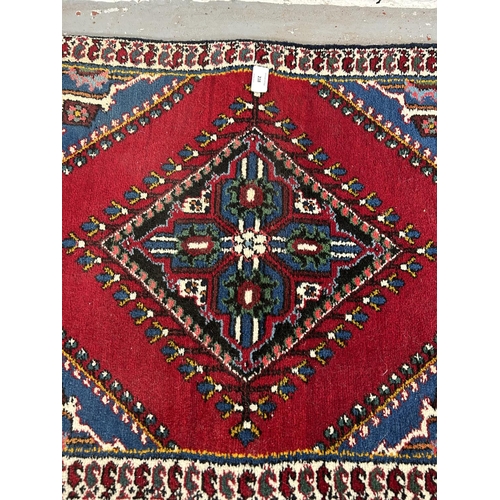 218 - A Persian hall runner - approx. 148cm x 60cm