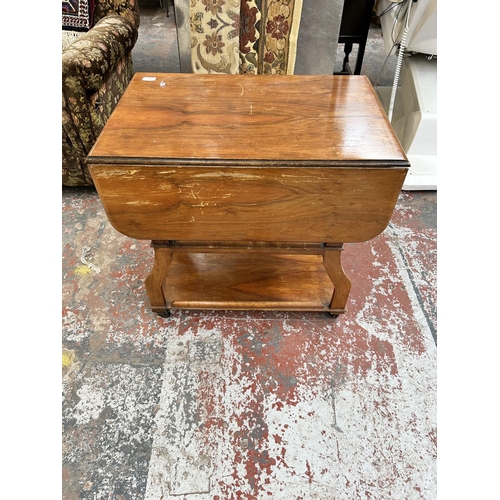 221 - A 1960s Tenax Manchester walnut drop leaf three tier tea trolley