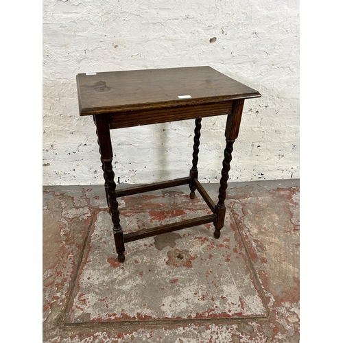 28 - An early 20th century oak rectangular side table on barley twist supports