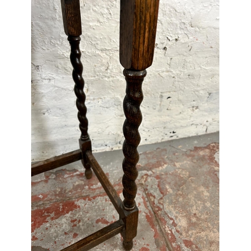 28 - An early 20th century oak rectangular side table on barley twist supports