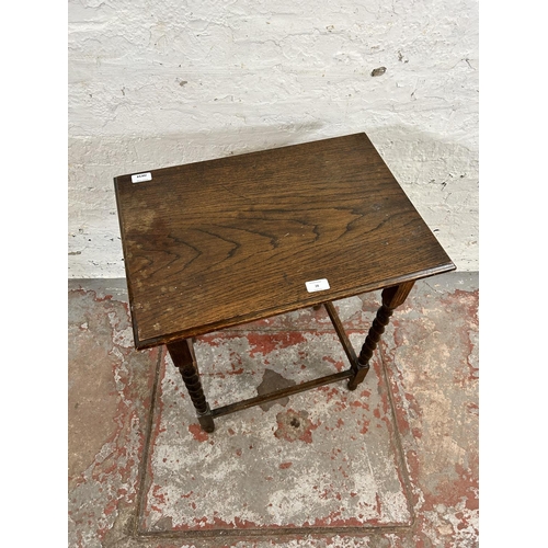 28 - An early 20th century oak rectangular side table on barley twist supports