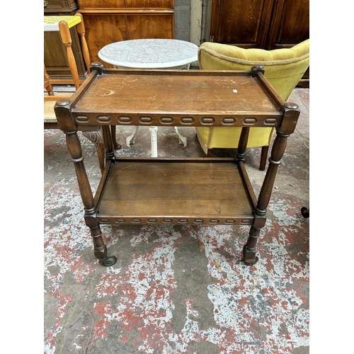 34 - A mid 20th century oak two tier tea trolley