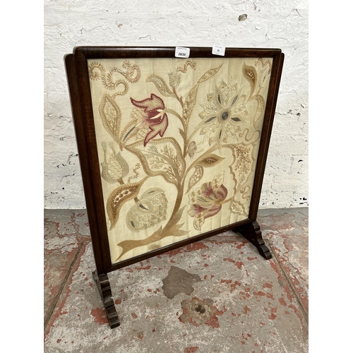 36 - An early 20th century mahogany framed and silk embroidered fire screen