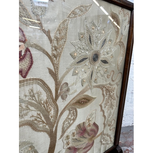 36 - An early 20th century mahogany framed and silk embroidered fire screen