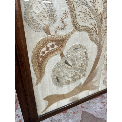 36 - An early 20th century mahogany framed and silk embroidered fire screen