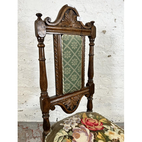 39 - An early 20th century carved oak and tapestry upholstered hall chair