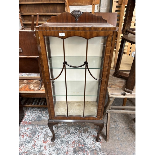 40 - A mid 20th century mahogany display cabinet with two internal glass shelves and cabriole supports