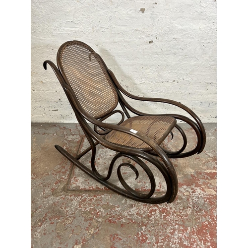 42 - A Thonet style bentwood and rattan rocking chair