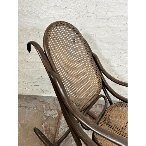 42 - A Thonet style bentwood and rattan rocking chair