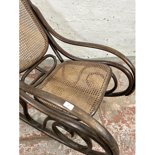 42 - A Thonet style bentwood and rattan rocking chair