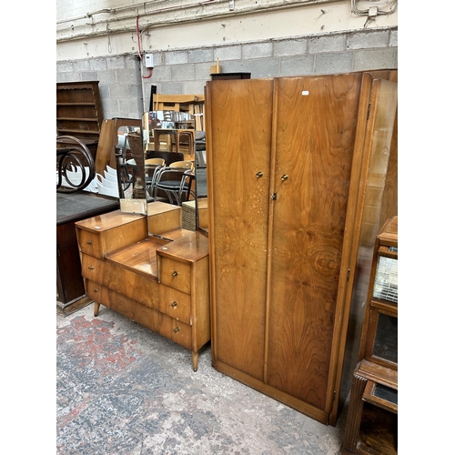 44 - A mid 20th century walnut two piece bedroom suite comprising double wardrobe and dressing table