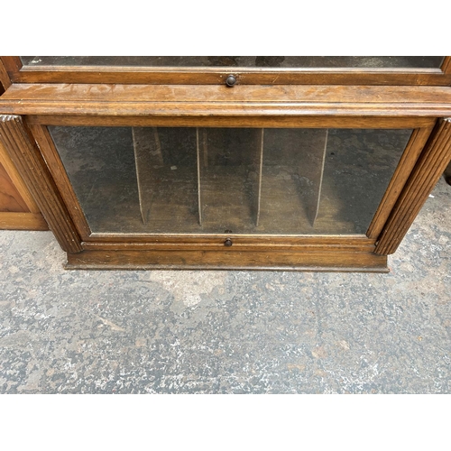 45 - A Globe Wernicke style walnut three section bookcase - approx. 107cm high x 90cm wide x 38cm deep