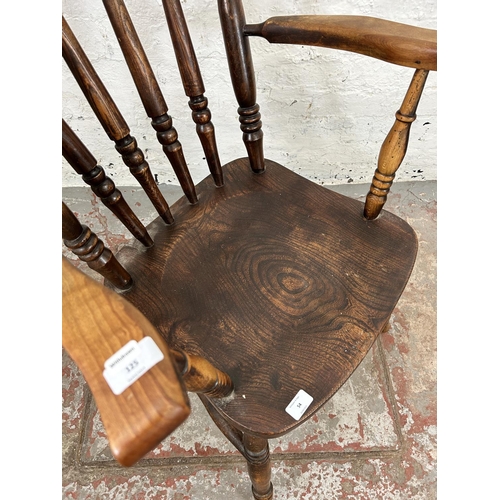 54 - A Victorian elm and beech spindle back farmhouse armchair