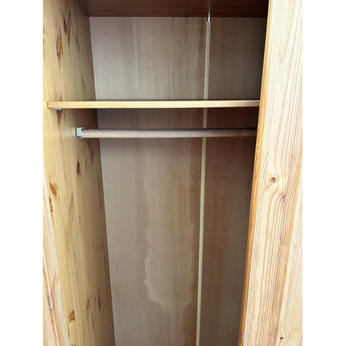 62 - A modern pine double wardrobe