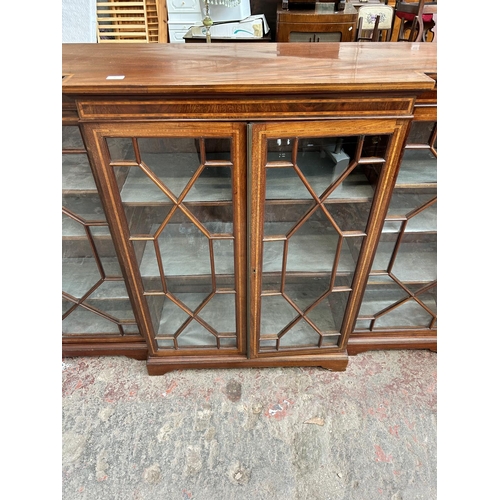 65 - An early 20th century Story & Triggs London inlaid mahogany breakfront astral glazed four door displ... 