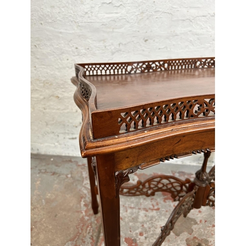 69 - A Georgian style sapele wood rectangular console table with carved fretwork