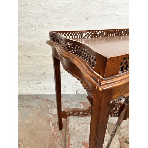 69 - A Georgian style sapele wood rectangular console table with carved fretwork