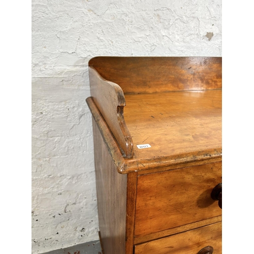 73 - A Victorian satin birch chest of two short over two long drawers with galleried back