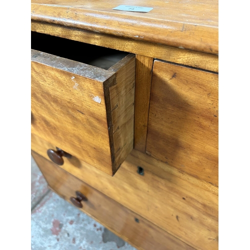 73 - A Victorian satin birch chest of two short over two long drawers with galleried back