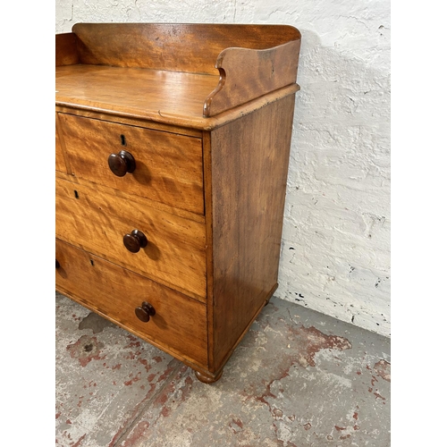 73 - A Victorian satin birch chest of two short over two long drawers with galleried back