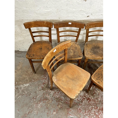 77 - A set of six 1950s beech dining chairs - more than one exhibit woodworm holes