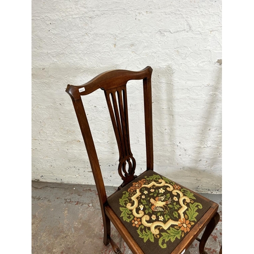 80 - A pair of Edwardian beech and tapestry upholstered dining chairs