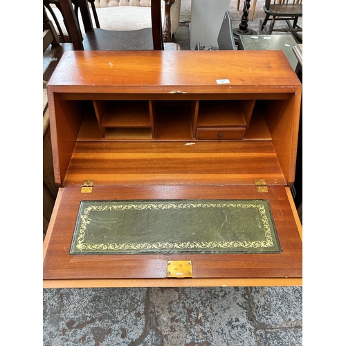 86 - A Georgian style yew wood bureau with four drawers and fall front