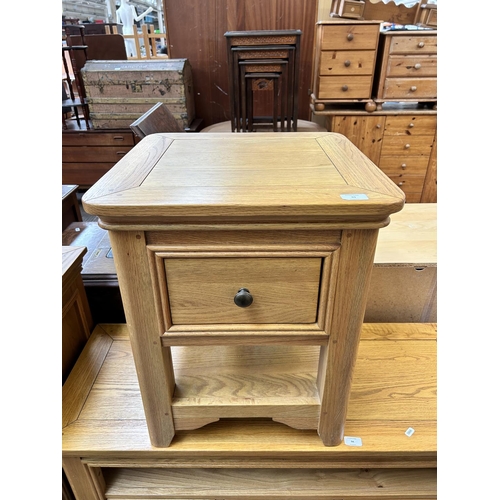 93 - A modern oak side table with single drawer