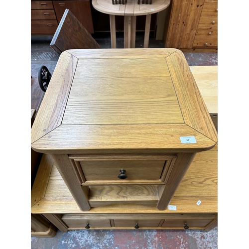 93 - A modern oak side table with single drawer