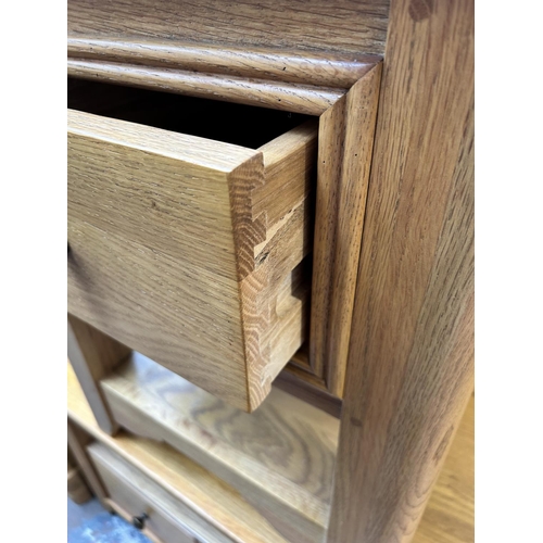 93 - A modern oak side table with single drawer