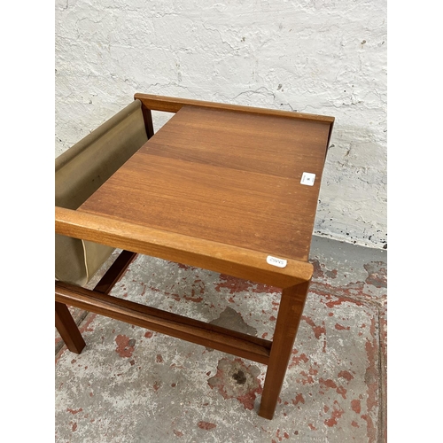 96 - A mid 20th century A. H. McIntosh & Co. Ltd teak and canvas magazine rack side table